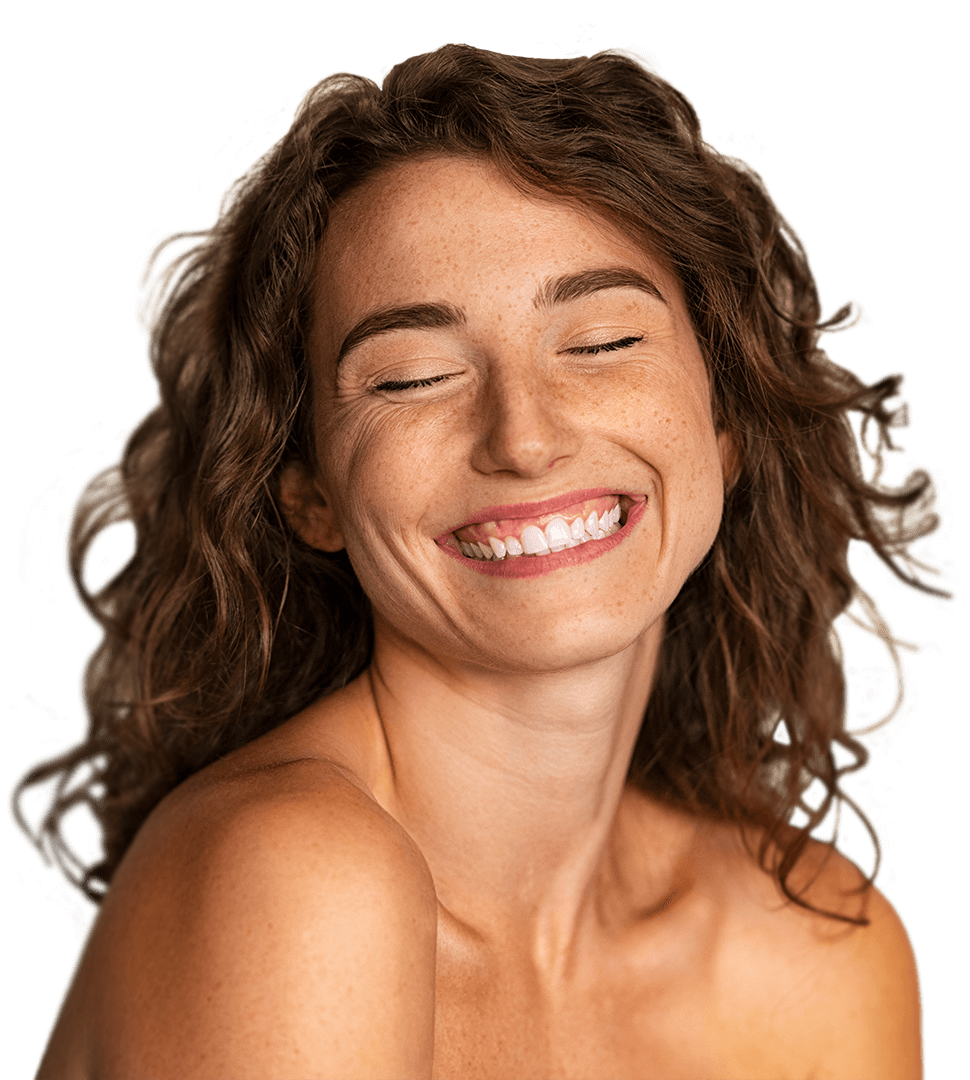 Woman with curly hair smiling widely with confidence