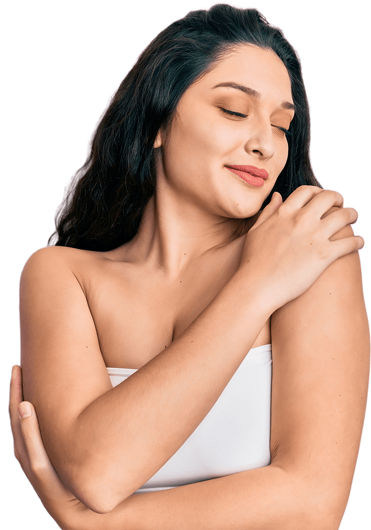 Woman hugging herself with a content smile